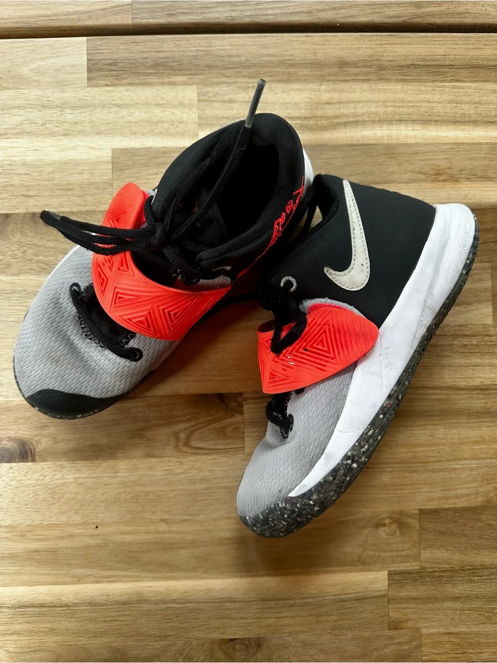 Nike Kyrie 4 sneakers in gray, black, and orange